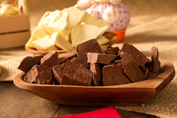 Wall Mural - Table with chocolate pieces and Easter decoration