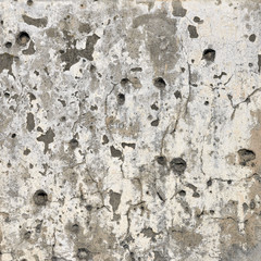 Concrete wall background with bullet holes