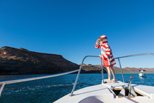 5 Year Old Boy At Bow Of Boat, Looking At The Sea Of Cortez, Mexican Baja