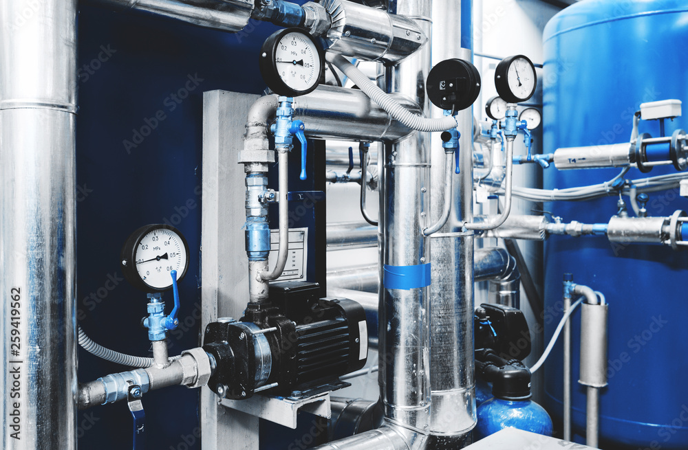 Water treatment pump and pipes with installed pressure gauges for ...