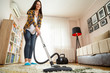 © Impact Photography - Woman vacuuming house