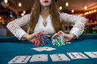 © RomanR - Woman in casino making bet with all chips