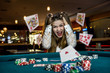 © RomanR - Upset woman in casino with falling cards