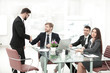 © yurolaitsalbert - handshake business colleagues near the office desktop