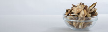 Sliced Dried Mushrooms In A Small Glass Bowl