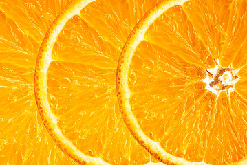 Wall Mural - Background of half cut oranges on orange background