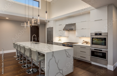 Beautiful Kitchen In New Luxury Home With Tall Ceiling Waterfall