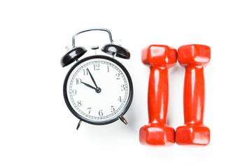 Wall Mural - alarm clock and dumbbells isolated on white