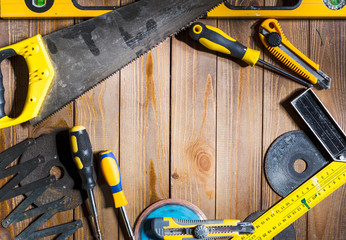 Wall Mural - Working tools on wooden rustic background.