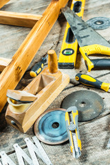 Wall Mural - Working tools on wooden rustic background.