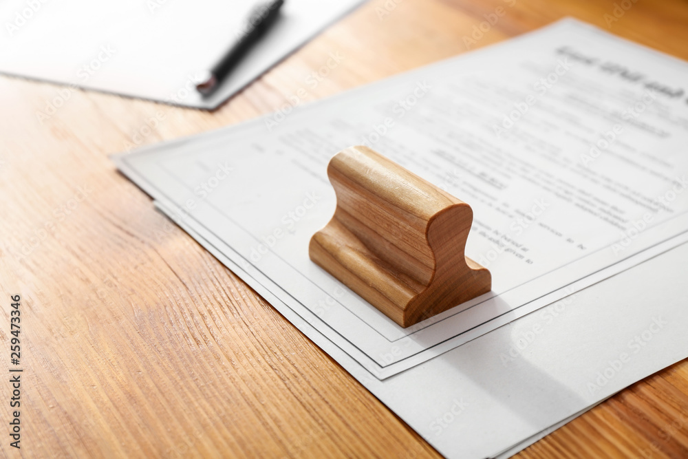 Document and stamp on table of notary public