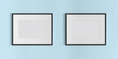 Two black frames hanging on a blue wall mockup