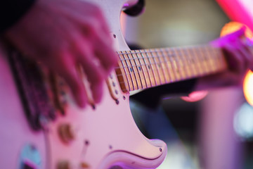 Speech by musicians on stage. Hands and musical instrument closeup. 