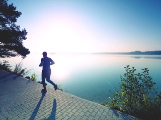 Freeze sportsman in  running pose.  Runner is sprinting