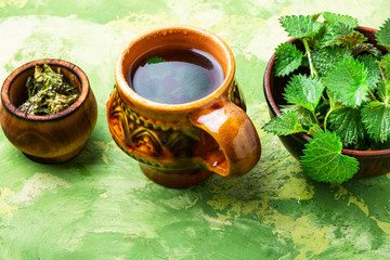 Wall Mural - Healing tea with nettle