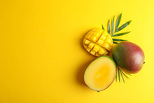 Cut Ripe Mangoes And Space For Text On Color Background, Top View