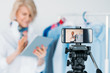 © golubovy - Senior lady lifestyle. Fashion trends coach. Busy woman with tablet shooting video for personal blog. Smartphone screen.