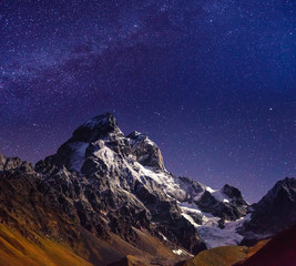 Wall Mural - scenic image of night sky over the peak ushba. location mestia, upper svaneti, georgia, europe.