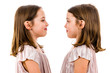 © _jure - Identical twin girls are looking at each other and smiling.