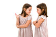 © _jure - Identical twin girls sisters are arguing yelling at each other.