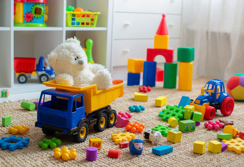 children's playroom with plastic colorful educational blocks toys. games floor for preschoolers kind