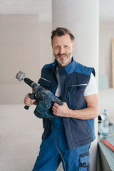 Sticker - Friendly handyman holding an electric power drill