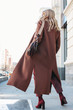 © Galina Zhigalova - Stylish fashionable blonde woman wearing coat and sunglasses, street style photo