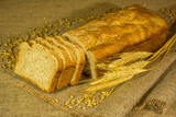 Fototapeta Kuchnia - fresh bread, wheat ears and grains