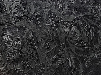 embossed shiny black leather with the floral motif