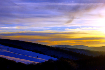 Wall Mural - coucher de soleil sur les montagnes enneigées des Vosges