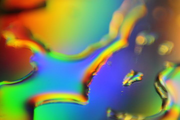 Aufkleber - abstract liquid colorful background with water droplets and splash on holographic surface