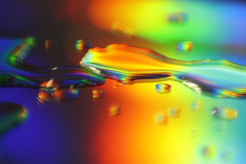 abstract colorful background with holographic liquid splash and droplets