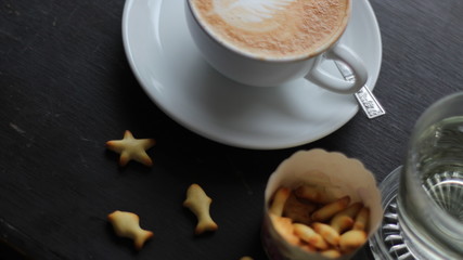 cup of coffee with beans on white background