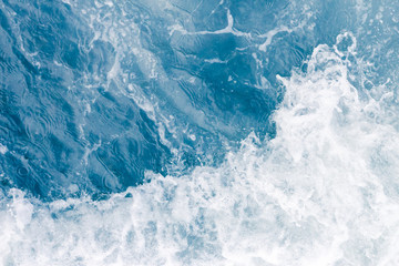 Wall Mural - Pale blue sea wave during high summer tide, abstract ocean background