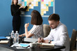 © Pixel-Shot - Young business people at meeting in office