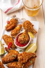 Wall Mural - Chicken nuggets with sauce and pepper on a white board. Copy space.