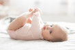 Leinwandbild Motiv Adorable little baby portrait. Cute baby girl indoor. 6 month child smiling.