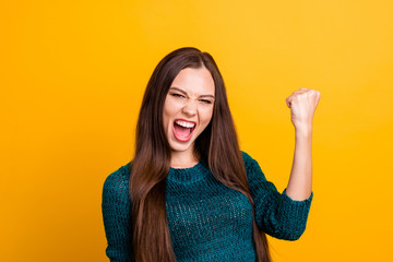 Sticker - Close up photo beautiful yelling loud her she lady open toothy mouth arm palm fist raised up air brown eyes ecstatic yes yeah wear green knitted pullover jumper clothes isolated yellow background