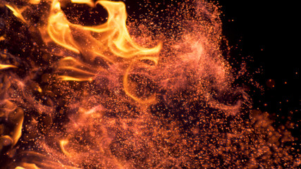 VERTICAL MACRO: Glowing particles popping out of a bonfire lit up in pitch black