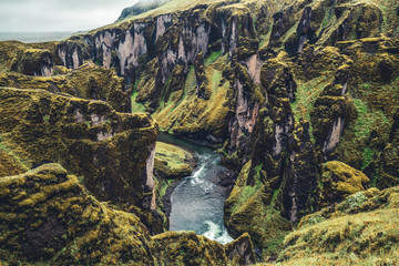 Unique landscape of Fjadrargljufur in Iceland. Top tourism destination. Fjadrargljufur Canyon is a massive canyon about 100 meters deep and about 2 kilometers long, located in South East of Iceland.