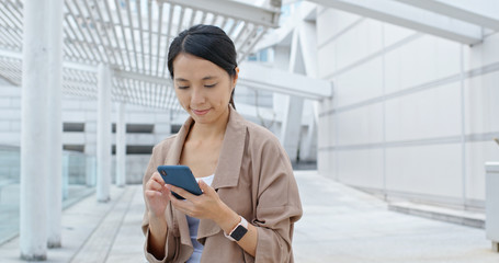 Poster - Woman use of mobile phone in city