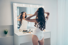 Rear Back Behind View Of Her She Nice-looking Shine Attractive Lovely Well-groomed Perfect Slim Fit Thin Cheerful Wavy-haired Lady Posing Standing In Front Of Mirror In Light White Interior Room