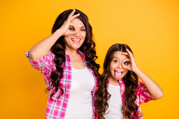 Poster - Portrait of nice attractive cheerful positive crazy foolish wavy-haired girls wearing checked shirt showing ok-sign like glasses isolated over bright vivid shine yellow background