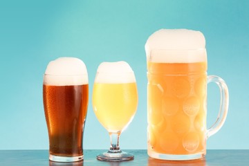 Wall Mural - Golden beer in glass with foam, alcohol beverage,  lager closeup.