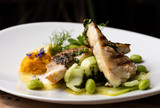 Fototapeta Sypialnia - Grilled sea bass fillet with ginger, fresh peppers and pak choy / Fusion food