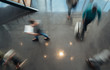 © JonoErasmus - Business people walking, blurred by motion shot from a top view