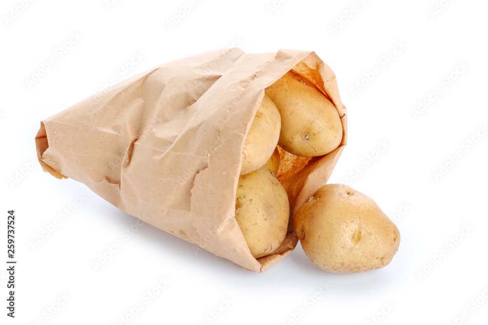 Bag with raw potato on white background