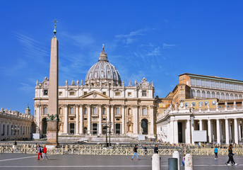 VATICAN CITY, VATICAN, Italy - March 2019: Fragments of the Papal Basilica of St. Peter (San Pietro Piazza) in the Vatican and columns on Saint Peter`s square in Rome