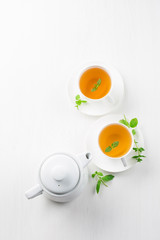 Wall Mural - cup of herbal tea, white background