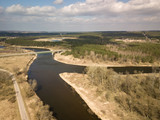 Fototapeta  - Aerial view of Nemunas river in Lithuania. Bridge over the river. Early spring scenery.